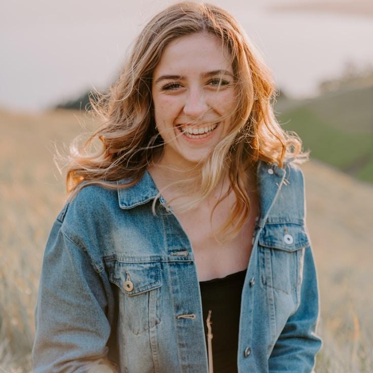 Aria Singh, Lead Design Curator at PetalStreamGlint, reviewing corporate floral arrangements